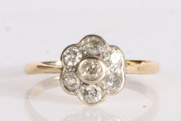 18 carat gold and diamond flower cluster ring, with seven bezel set old brilliant cut diamonds,