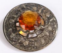 Large Scottish silver plated plaid brooch, centred with a large orange stone within a thistle