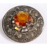 Large Scottish silver plated plaid brooch, centred with a large orange stone within a thistle