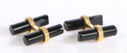 A pair of gilt metal and black onyx cufflinks, with rope design to the gilt metal 20mm wide