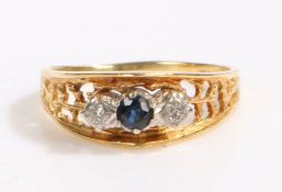 18 carat gold diamond and sapphire ring, the head set with a central claw mounted round cut sapphire