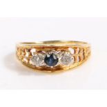 18 carat gold diamond and sapphire ring, the head set with a central claw mounted round cut sapphire