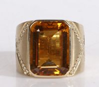 18 carat gold citrine and diamond ring, the central rectangular facet cut citrine housed in an 18