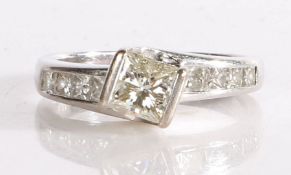 18 carat white gold diamond set ring, the central 1 carat princess cut diamond with a further four