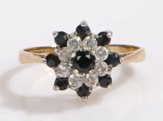 9 carat gold paste and black stone ring, the head in the form of a flower set with paste and black