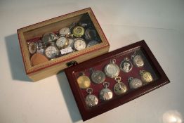 Pocket watches to include Smiths, Ingersoll etc. housed in two cabinets with hinged lids (2)