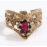 Unusual 9 carat gold and garnet ring, the head set with a claw mounted pear shaped garnet stone