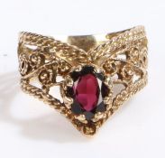 Unusual 9 carat gold and garnet ring, the head set with a claw mounted pear shaped garnet stone