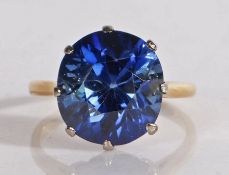 18 carat gold and sapphire ring, the central oval/round faceted sapphire measuring 12.3mm wide, 13.