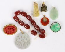 A collection of Asian jewellery, to include a Chinese lacquer brooch, jade pendants and hardstone