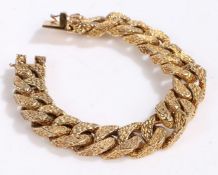 Unusual and heavy 9 carat gold link bracelet, with a mottled design weight 89.5
