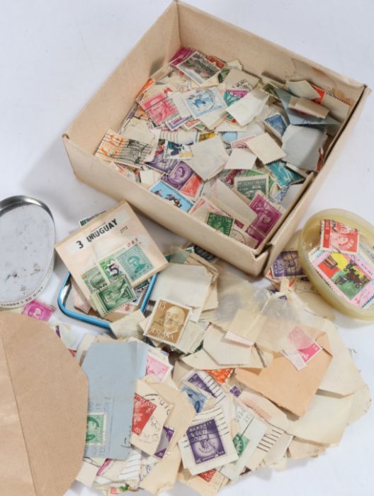 Collection of used loose world stamps, housed in a small box and envelope