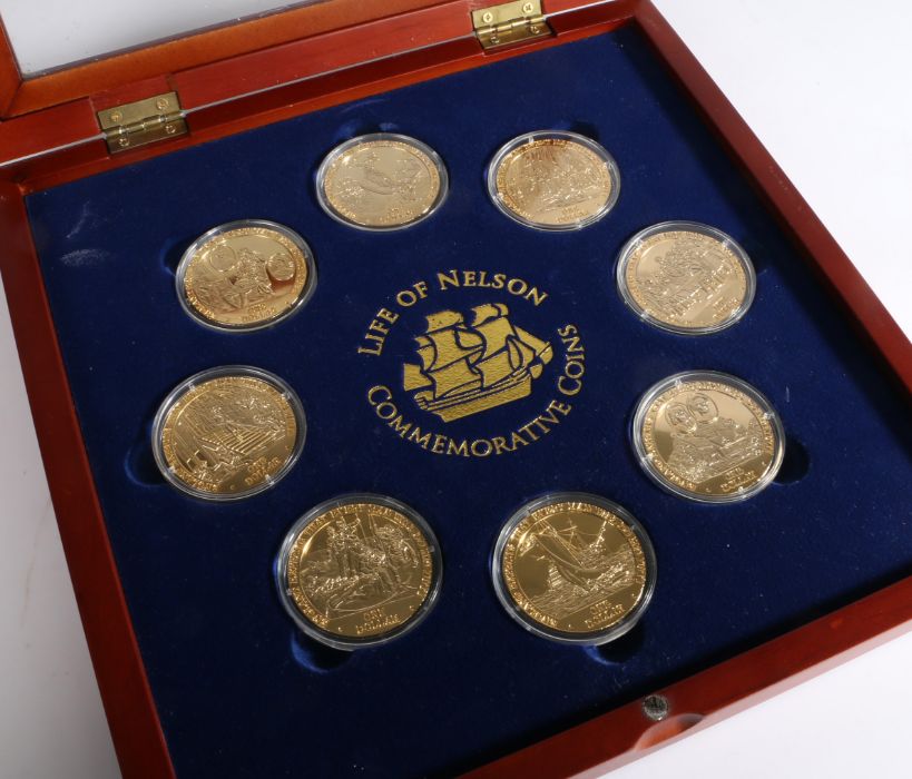 Eight Cook Islands one dollar coins 2007, depicting the life of Nelson, all capsulated and housed in