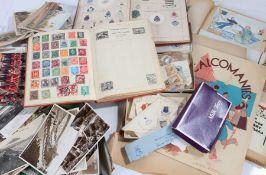 Collection of early 20th century postcards, two stamp albums with part contents, an edition of Arms,
