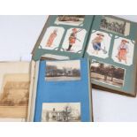 Early 20th century postcard album with contents and a scrap book with part contents of cut-out