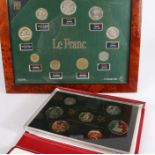 Royal Mint 1988 coin set, in red leather case, Hughes Allen Centenary, together with Le Franc set,