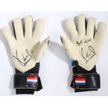 A pair of Norwich City used goal keeper signed gloves, signed by Tim Krul. These glove have been