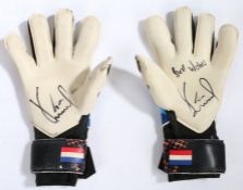 A pair of Norwich City used goal keeper signed gloves, signed by Tim Krul. These glove have been