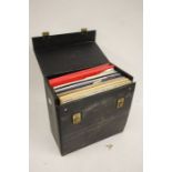 A collection of vinyl records in a carrying case