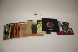 A collection of approx.15 mixed 7" singles. Beastie Boys / Pink Floyd / Madness / etc.