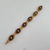 Vintage-Armband -SPHINX/ England, 2.Hälfte 20. Jh., goldfarbenes Metall mit historisierendem Dekor,