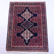 Persischer Orientteppich - Wolle, blaugrundig, ornamentales und florales Muster, mehrfache Bordüre,