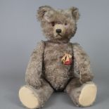 Teddy "Tricky" - Schuco, um 1950, Kunststoff-Brustschild mit Schleife, made in US Zone, Mohair, bew