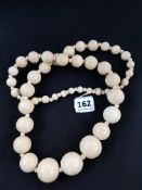 STRING OF HAND CARVED WOODEN BEADS