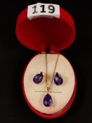 14 CARAT GOLD AND PURPLE STONE PENDANT WITH MATCHING EARRING