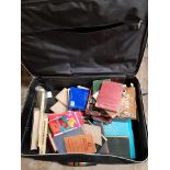 LARGE SUITCASE OF BOOKS