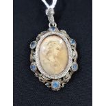 ANTIQUE MINIATURE ON IVORY IN A SILVER AND GOLD MOUNT WITH BLUE TOPAZ