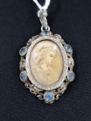 ANTIQUE MINIATURE ON IVORY IN A SILVER AND GOLD MOUNT WITH BLUE TOPAZ