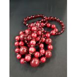 1960'S CHERRYWOOD BEAD NEKCLACE PLUS DIAMOND CUT GARNET COLOURED NECKLACE