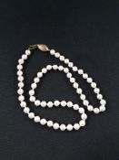 STRAND OF PEARLS WITH 9 CARAT GOLD CLASP
