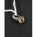 9 CARAT GOLD SAPPHIRE AND DIAMOND PENDANT IN LEOPARD DESIGN