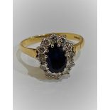 18 CARAT GOLD SAPPHIRE AND DIAMOND CLUSTER RING