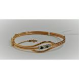 18 CARAT ROLLED GOLD BLUE AND WHITE SAPPHIRE BANGLE