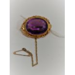 VICTORIAN 15 CARAT GOLD AND AMETHYST BROOCH