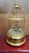 SWISS EDWARDIAN MUSICAL BIRD CAGE WITH TWO BIRDS AND IN WORKING ORDER