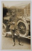 POSTCARD - IRISH ARMY DRIVER BESIDE VEHICLE