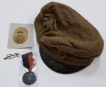 FEMALE BLACK AND TAN MEDAL, 9 CARAT GOLD. CUMANN NA MBAN BADGE, PHOTO AND PEAKED CAP