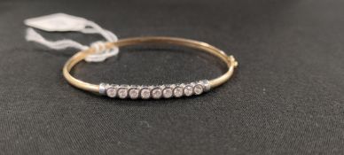 9 CARAT GOLD AND CZ BANGLE