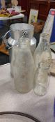 SMALL CREAMERY CAN AND 3 OLD MILK BOTTLES