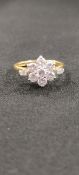 STUNNING 18 CARAT GOLD AND DIAMOND CLUSTER RING WITH BAGUETTE SHOULDER WITH CIRCA 1.1 CARAT OF