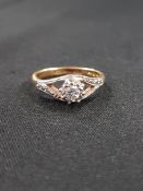 18 CARAT GOLD SIGNLE DIAMOND RING WITH DIAMOND SHOULDERS