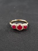 18 CARAT 3 STONE RUBY AND DIAMOND CLUSTER RING