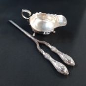 SILVER HANDLED CURLING TONGS AND SILVER SAUCEBOAT