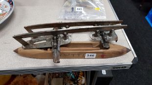 OLD ICE SKATES AND LOOM SHUTTLE