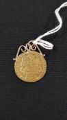 22 CARAT GOLD WITH 9 CARAT MOUNT GUINEA COIN