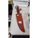 LARGE BOWIE STYLE KNIFE AND SHEATH, 14 INCHES LONG, STEEL BLADE WITH WOODEN HANDLE AND LEATHER